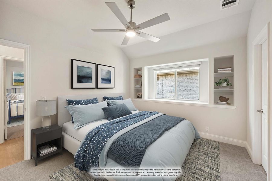 Bedroom with vaulted ceiling, ceiling fan, built-in shelves, and large window with blue bedding Bedroom with vaulted ceiling, ceiling fan, built-in shelves, and large window with blue bedding