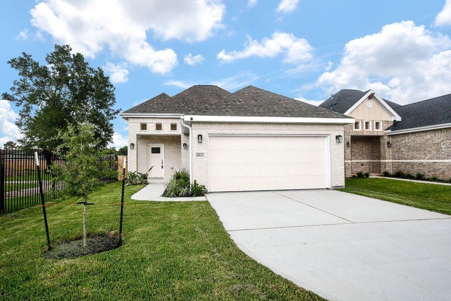 Front exterior of a new home in , Houston, TX, highlighting curb appeal (Image 21).