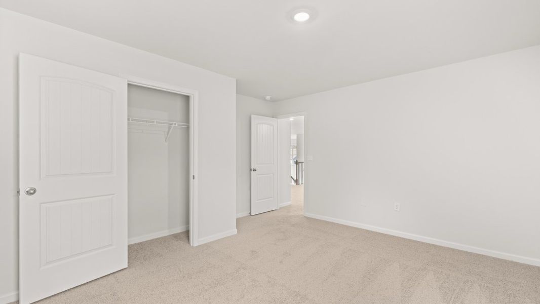 Representative unfurnished interior of a home built from the Westerly by D.R. Horton in Haven Abbey, Cumming (Image 27).