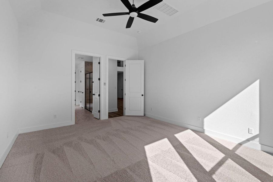 Primary Bedroom with elevated ceiling