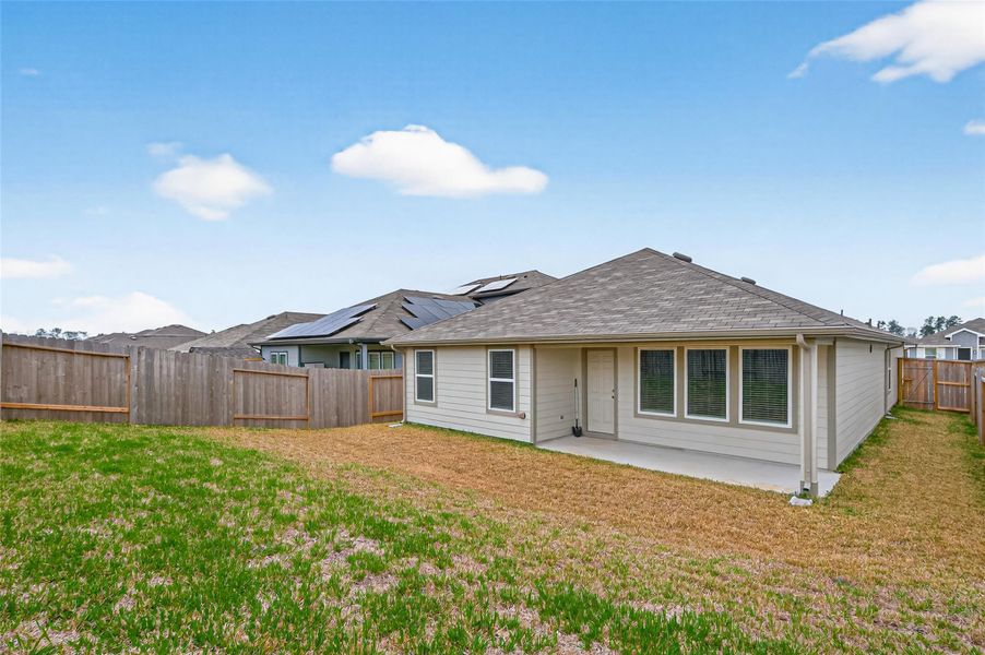 Exterior details and patio area of a home in Presswoods, Splendora (Image 27).