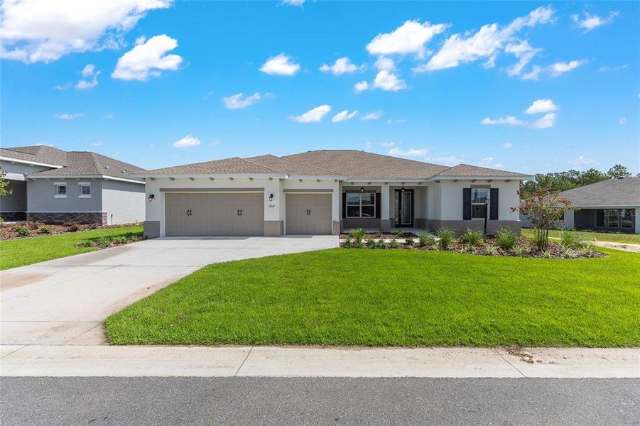 Front exterior of a new home in On Top of the World Communities, Ocala, FL, highlighting curb appeal (Image 20).