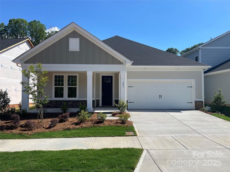 Front exterior of a new home in , Cramerton, NC, highlighting curb appeal (Image 1).