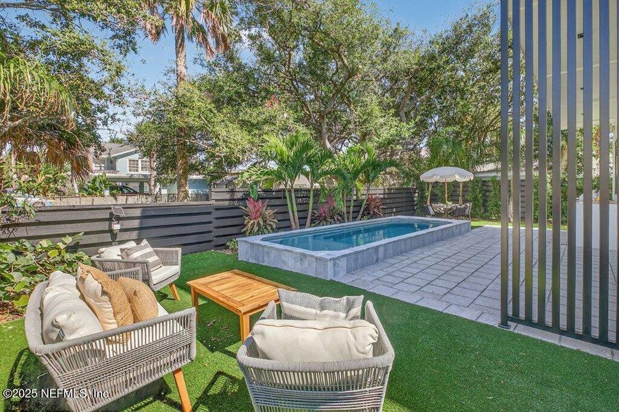 Exterior details and patio area of a home in , Neptune Beach (Image 50).