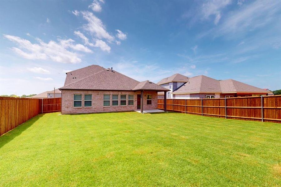 Front exterior of a new home in Kings Way, Denton, TX, highlighting curb appeal (Image 17). Front exterior of a new home in Kings Way, Denton, TX, highlighting curb appeal (Image 17).