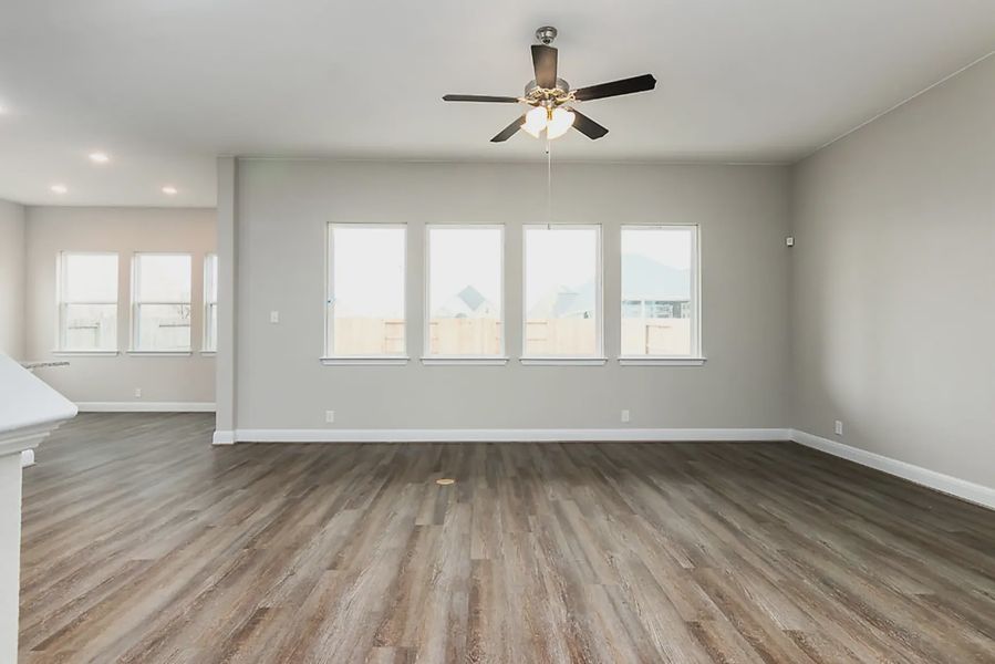 Representative unfurnished interior of a home built from the Finnigan by Chesmar Homes in Buffalo Crossing, Cibolo (Image 8).
