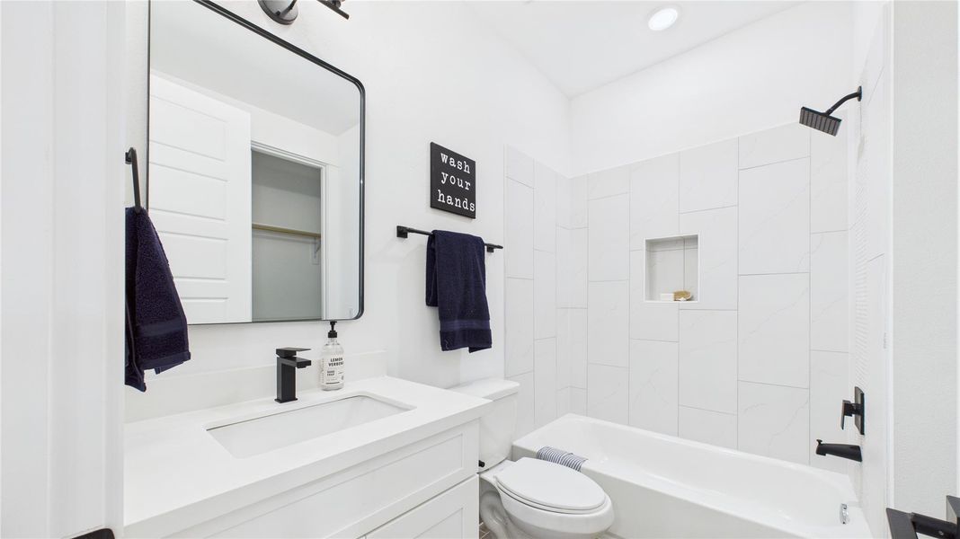 This well-appointed ensuite bathroom in the third-floor secondary bedroom features a versatile shower/tub combo, offering both convenience and relaxation. Designed with modern fixtures, a stylish vanity, and quality finishes, it provides a comfortable and functional space. Thoughtful lighting enhances the ambiance, making it a practical yet inviting addition to the home. This well-appointed ensuite bathroom in the third-floor secondary bedroom features a versatile shower/tub combo, offering both convenience and relaxation. Designed with modern fixtures, a stylish vanity, and quality finishes, it provides a comfortable and functional space. Thoughtful lighting enhances the ambiance, making it a practical yet inviting addition to the home.