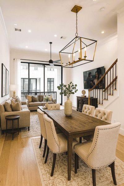 12 FT Soaring Living Room Ceilings - Those Great 10 FT Tall Tri-Paneled Glass Doors- Double Crown Molding - Wide Plank Wood Flooring (Pic was virtually stage  - chandelier was staged as well)