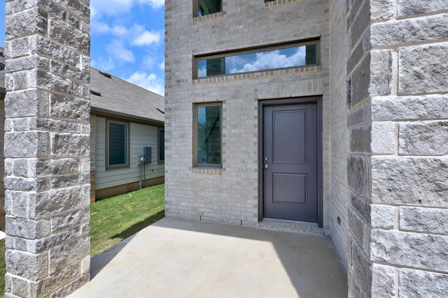 Exterior details and patio area of a home in Trinity Ranch, Elgin (Image 29).
