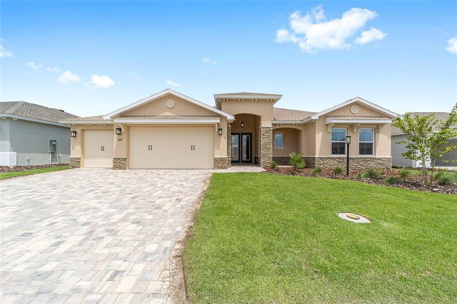 Front exterior of a new home in On Top of the World Communities, Ocala, FL, highlighting curb appeal (Image 24).