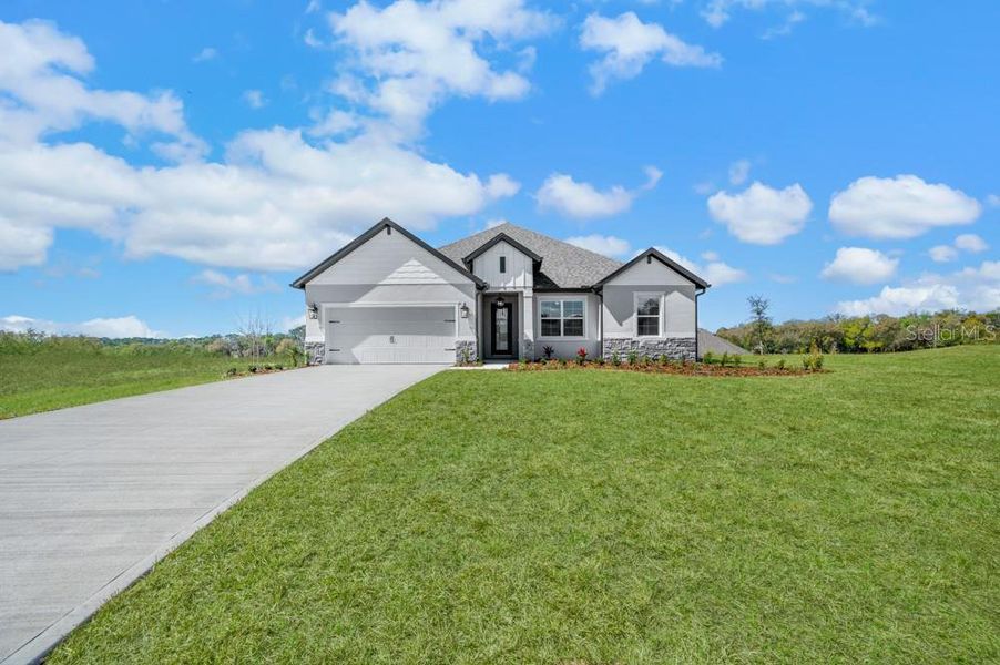 Front exterior of a new home in , Fruitland Park, FL, highlighting curb appeal (Image 2). Front exterior of a new home in , Fruitland Park, FL, highlighting curb appeal (Image 2).