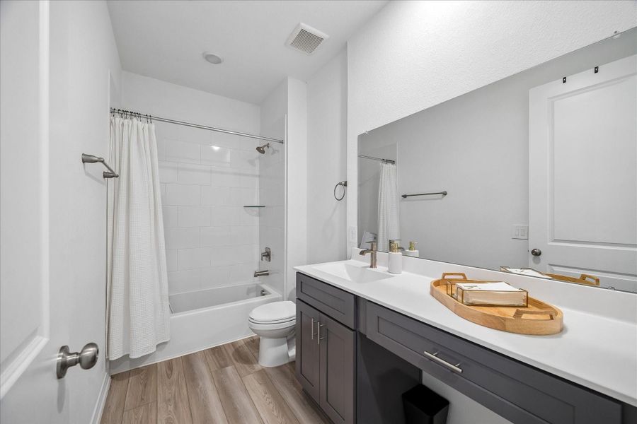 Stylish full bath conveniently located near secondary bedrooms.
