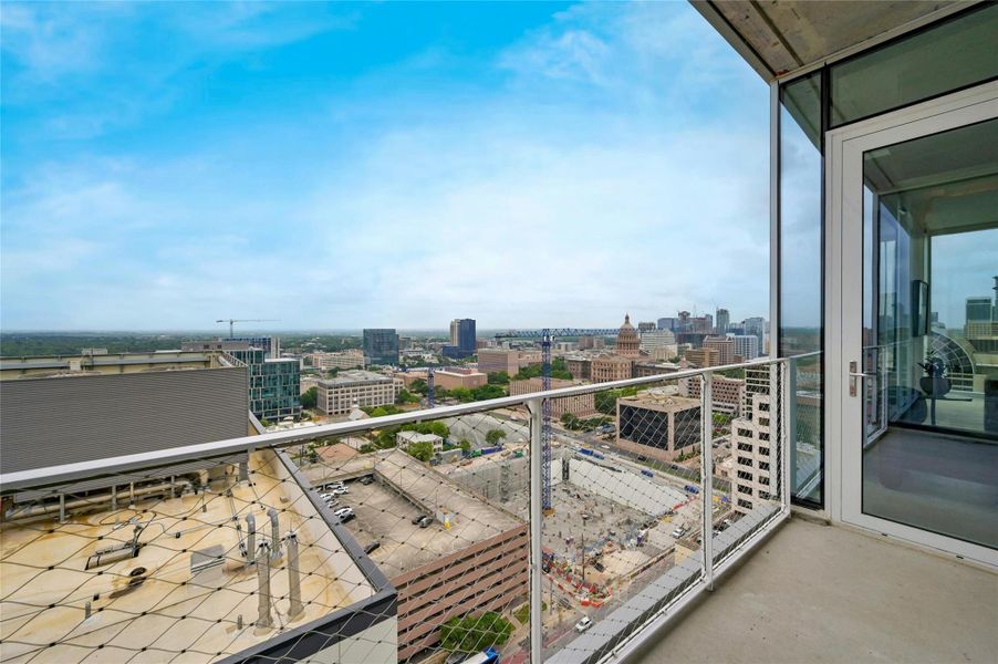 Step outside to the balcony and immerse yourself in breathtaking views of the surrounding cityscape. This outdoor retreat offers a perfect spot to unwind and enjoy the fresh air while taking in the vibrant energy of the city. *Linden Residence No. 2107 Furnished Model Shown Here