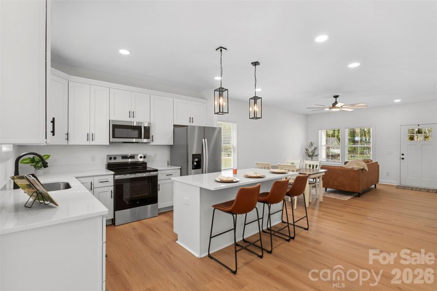 Quartz countertops, soft close cabinetry, stainless steel appliances