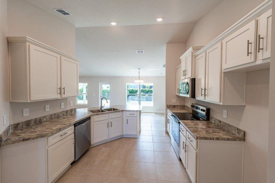 Furnished interior view inside a new home in Bayshore, Port St. Lucie (Image 5). Furnished interior view inside a new home in Bayshore, Port St. Lucie (Image 5).