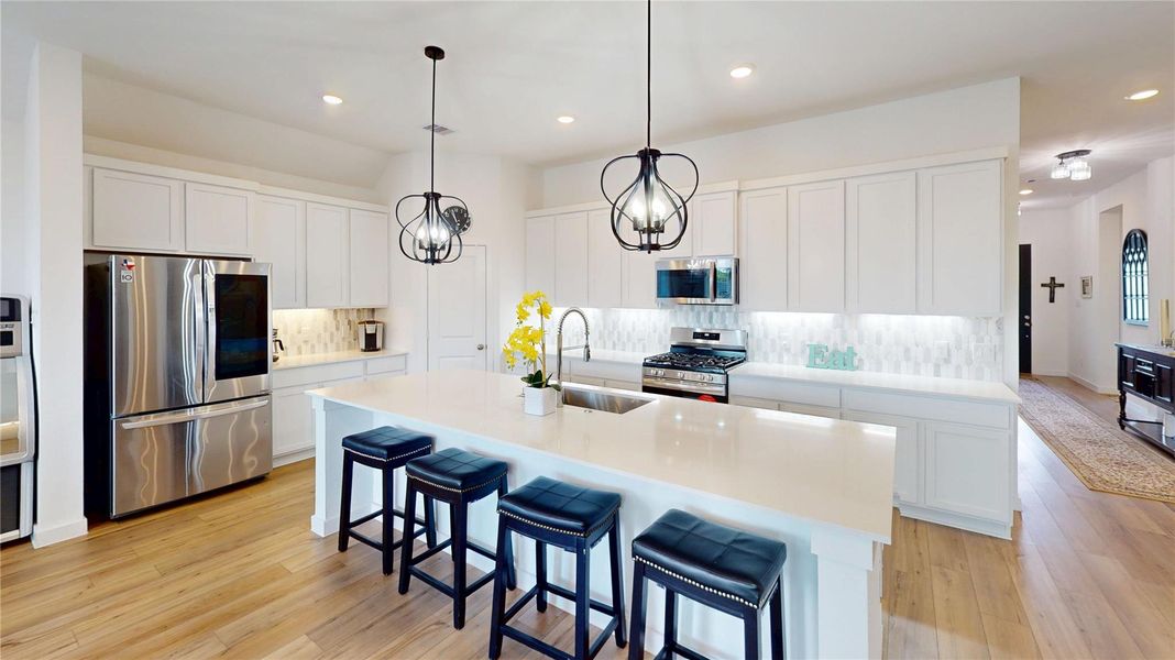Upgraded Pendant Lighting, Quartz Counters, Breakfast Bar Upgraded Pendant Lighting, Quartz Counters, Breakfast Bar