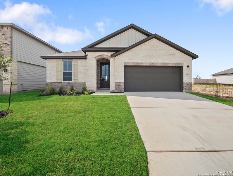 Front exterior of a new home in Morgan Meadows, San Antonio, TX, highlighting curb appeal (Image 1).