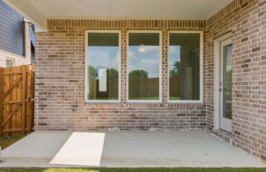 Exterior details and patio area of a home in Ribbonwood, Aubrey (Image 3).