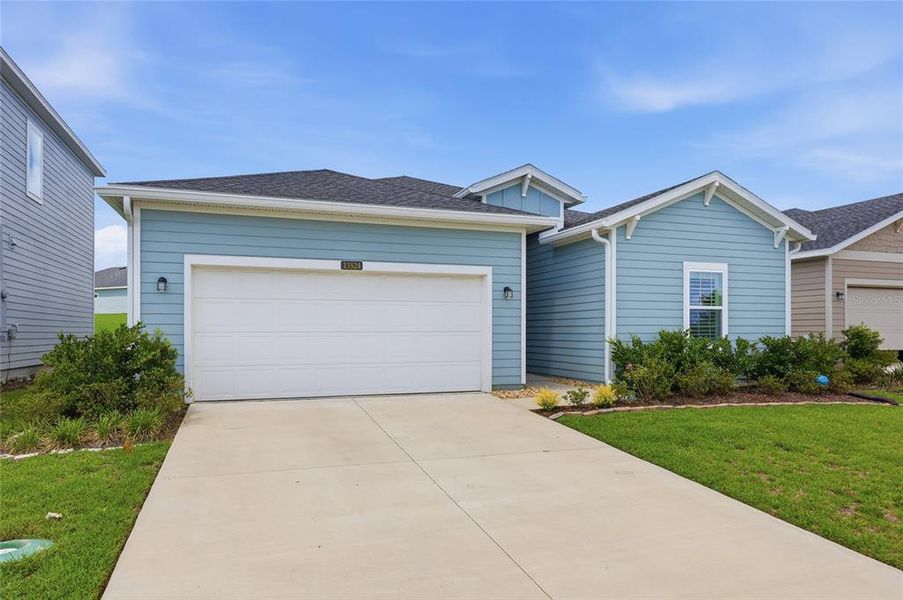 Front exterior of a new home in Trailhead Landing, Alachua, FL, highlighting curb appeal (Image 23).