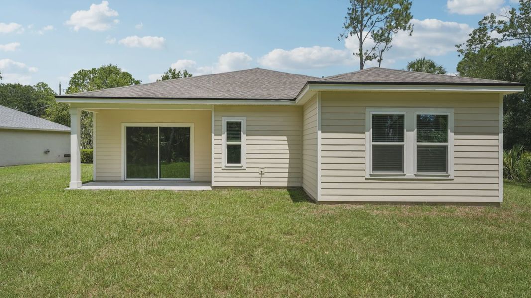 Elegant covered patio complements this Palm Coast home's seamless indoor-outdoor living experience.