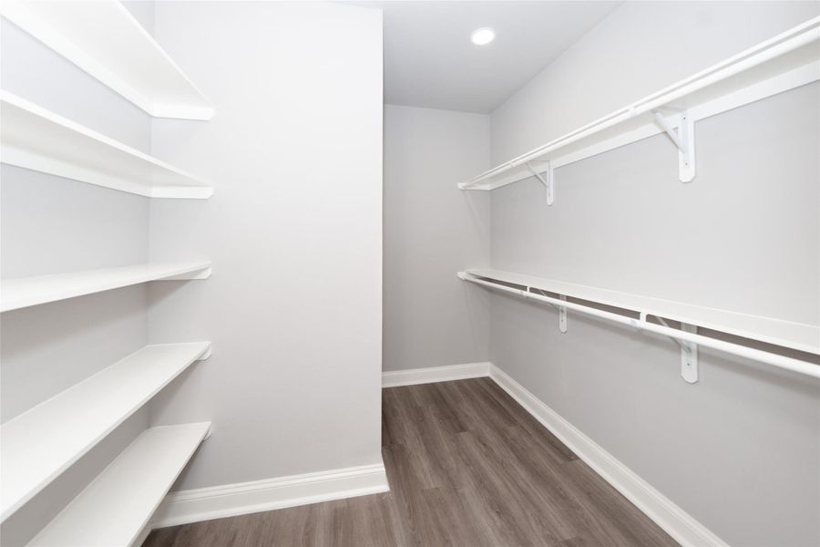 This roomy closet offers plenty of space to organize and store your wardrobe with ease. Its well-designed layout makes it simple to keep everything in place, while the spacious interior provides room for all your essentials and more. With ample shelving and hanging space, this closet is both functional and inviting, making it a true standout in your home.