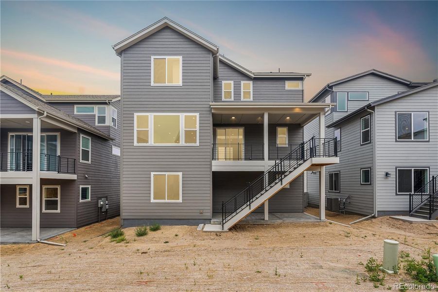 Front exterior of a new home in Tribute at Lyric, Lone Tree, CO, highlighting curb appeal (Image 2).