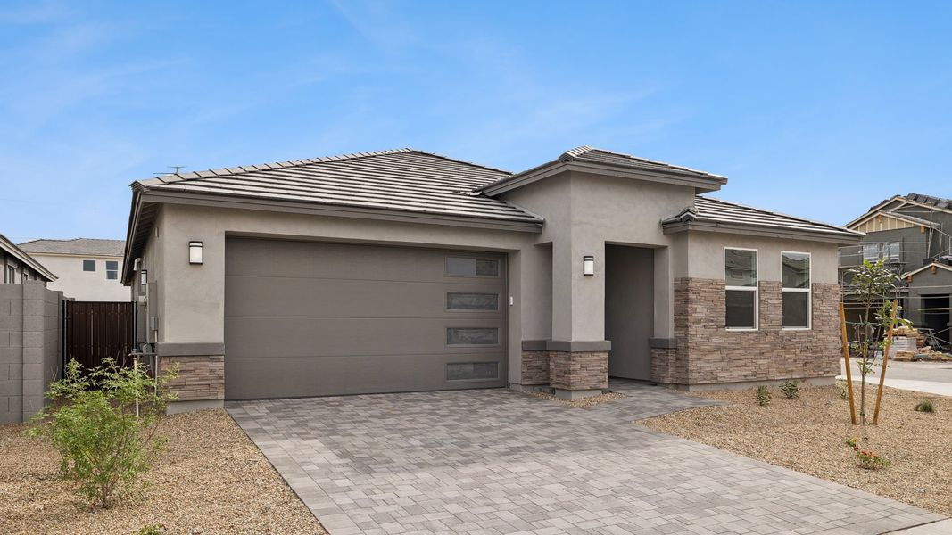 Representative exterior photo of a completed home built from the Tapatio by D.R. Horton in The Ridge at Stone Butte, Phoenix, AZ (Image 24).