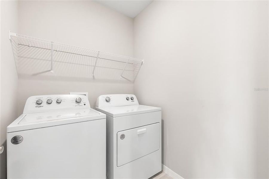 Furnished interior view inside a new home in Cove at West Port - Tradition, Port Charlotte (Image 5).