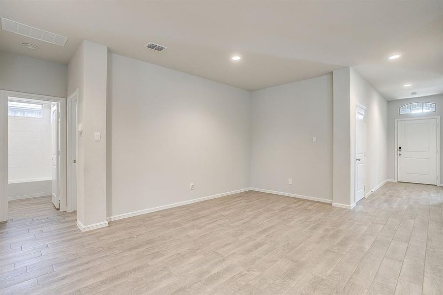 Spare room with light wood-style flooring and recessed lighting