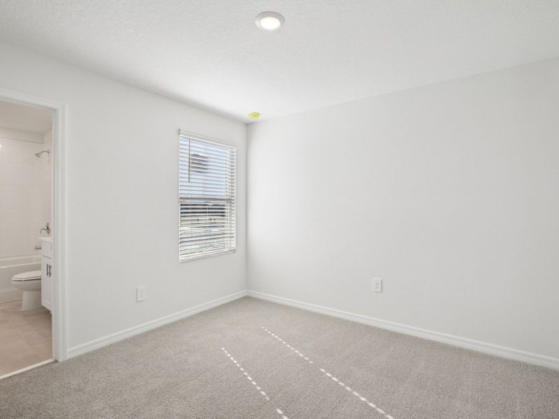 Spacious, unfurnished interior of a new home in The Reserve at Hammock Oaks Townes, Lady Lake (Image 12).