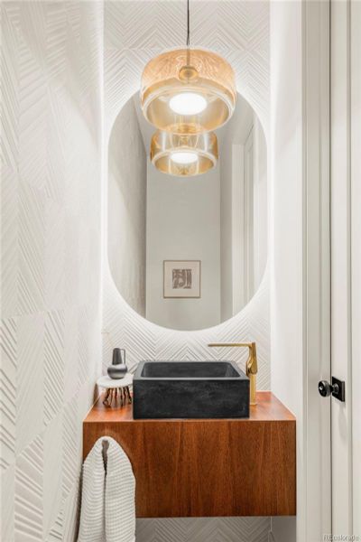 Curated powder bath on main level Curated powder bath on main level