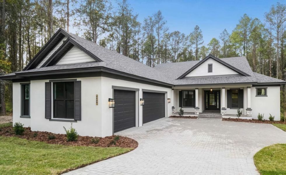 Representative exterior photo of a completed home built from the Custom Home by AR HOMES in Southern Hills Plantation, Brooksville, FL (Image 1).