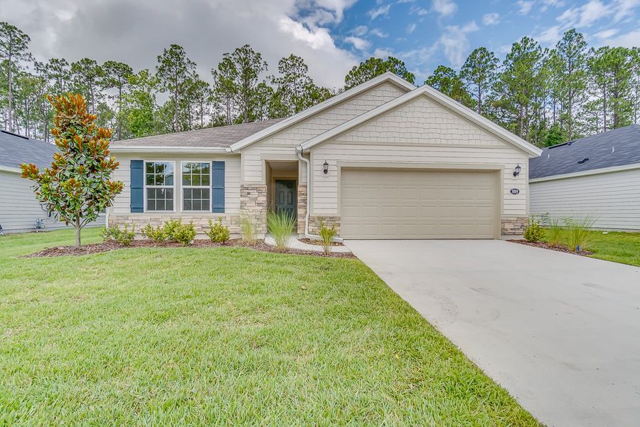 Front exterior of a new home in Anabelle Island - Executive Series, Green Cove Springs, FL, highlighting curb appeal (Image 1). Front exterior of a new home in Anabelle Island - Executive Series, Green Cove Springs, FL, highlighting curb appeal (Image 1).