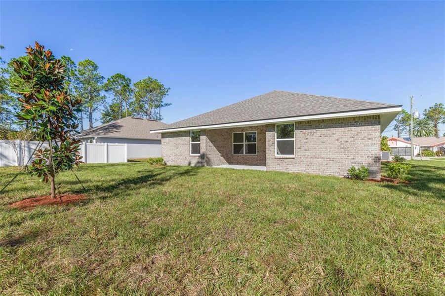 Front exterior of a new home in Palm Coast, Palm Coast, FL, highlighting curb appeal (Image 16).