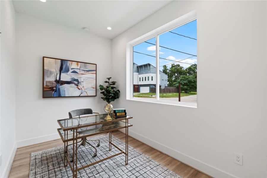 One of two guest bedrooms on the first floor, also a great option for a home office or cozy reading space. One of two guest bedrooms on the first floor, also a great option for a home office or cozy reading space.