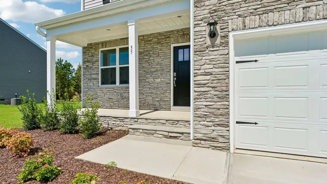 Exterior details and patio area of a home in The Landing at Winston Pointe, Clayton (Image 3).