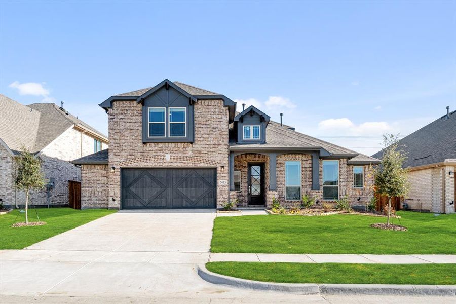Front exterior of a new home in Sonoma Verde, McLendon-Chisholm, TX, highlighting curb appeal (Image 1).