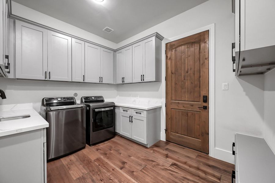 Stairs wrapped in wood and iron lead to a private office/flex space with a balcony overlooking Lake Apache.