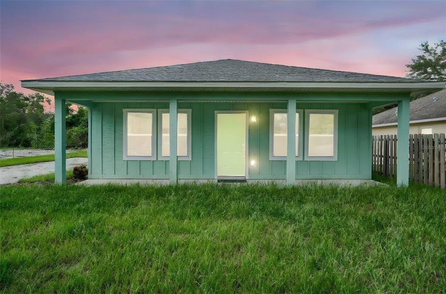 Front exterior of a new home in , Lady Lake, FL, highlighting curb appeal (Image 1).