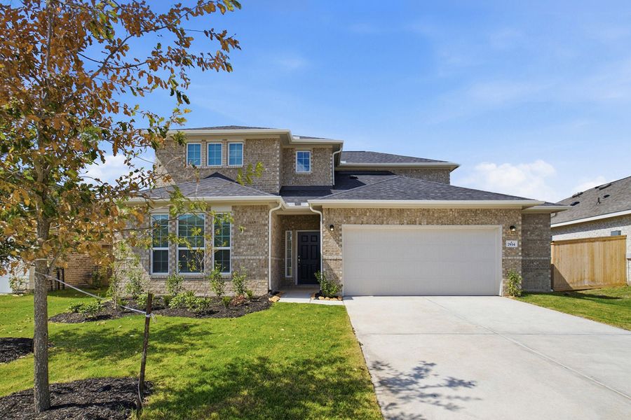 Front exterior of a new home in Ashland, Richwood, TX, highlighting curb appeal (Image 1). Front exterior of a new home in Ashland, Richwood, TX, highlighting curb appeal (Image 1).