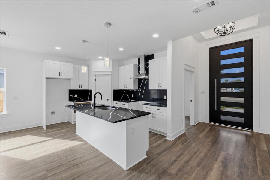 Different view of kitchen, entrance and bedroom 1