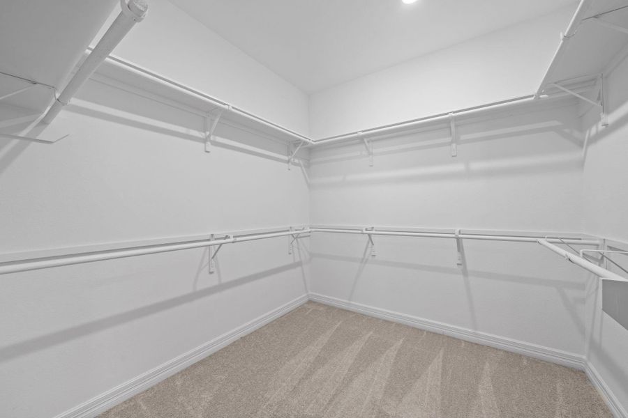 A view of your large primary walk-in Closet