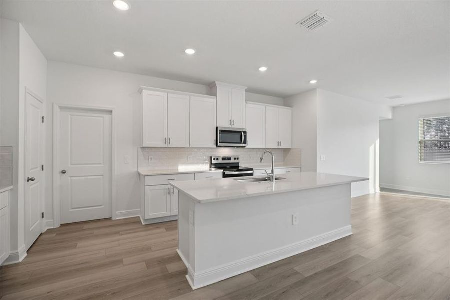 Furnished interior view inside a new home in Cyrene at Minneola - Villas, Minneola (Image 8).