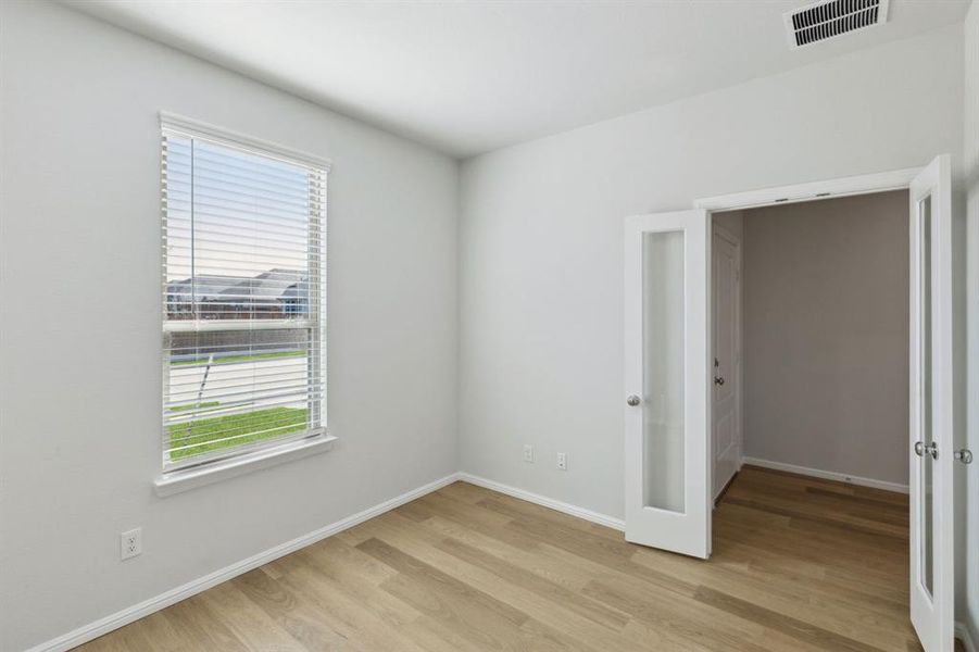 Study in the Holden home plan by Trophy Signature Homes – REPRESENTATIVE PHOTO