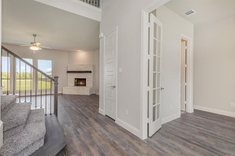 Corridor with dark hardwood / wood-style floors