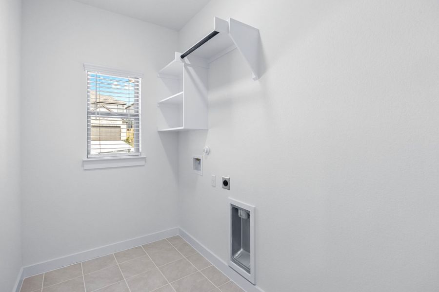 Utility Room in the Cypress home plan by Trophy Signature Homes - REPRESENTATIVE PHOTO