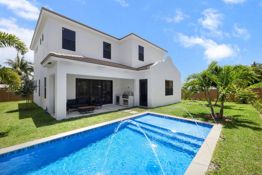 Front exterior of a new home in , Palm Beach Shores, FL, highlighting curb appeal (Image 24). Front exterior of a new home in , Palm Beach Shores, FL, highlighting curb appeal (Image 24).