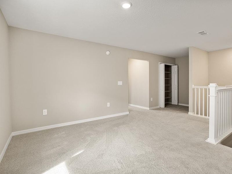A flex-use loft is located at the upstairs landing.