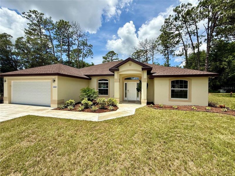 Front exterior of a new home in , Dunnellon, FL, highlighting curb appeal (Image 26).