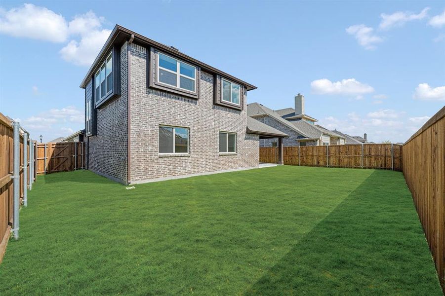 Exterior details and patio area of a home in Woodstone, Providence Village (Image 24). Exterior details and patio area of a home in Woodstone, Providence Village (Image 24).